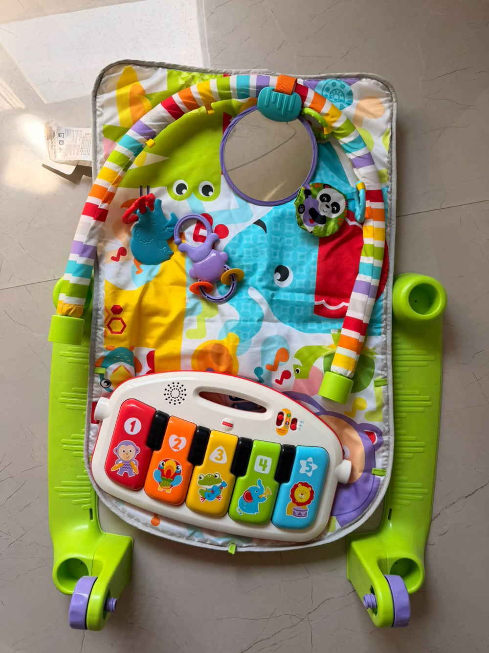 FISHER-PRICE Grow & Glow Baby Play Gym with colourful activity toys and interactive play mat.