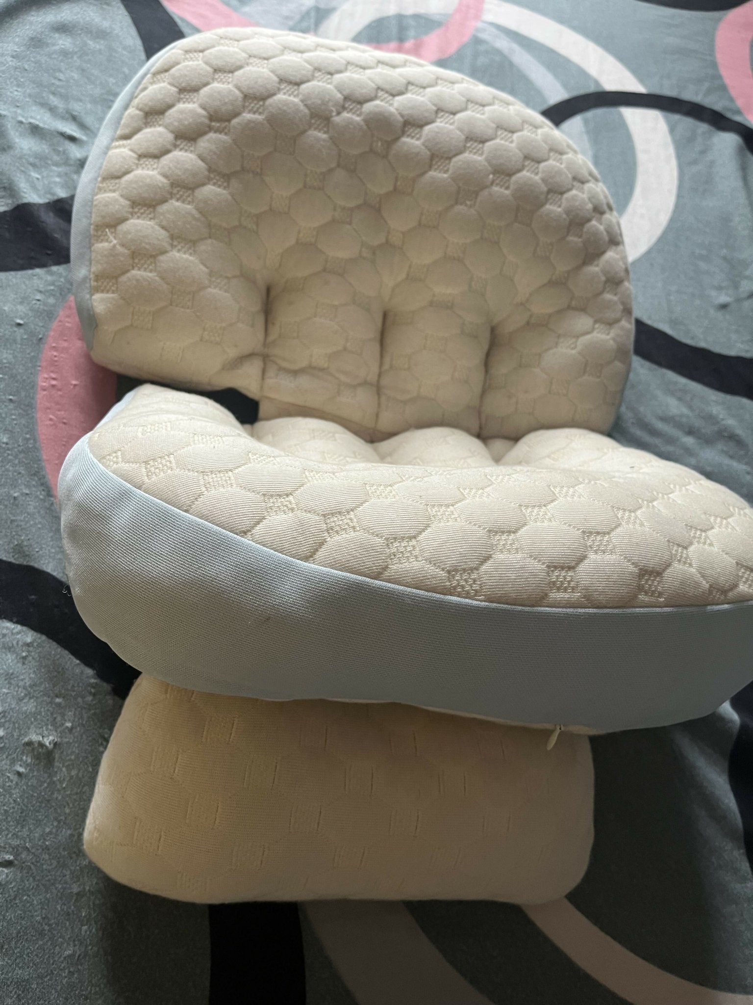 Frido maternity pillow with ergonomic full-body support, soft breathable fabric, and a comfortable design to support the back, belly, hips, and legs during pregnancy.