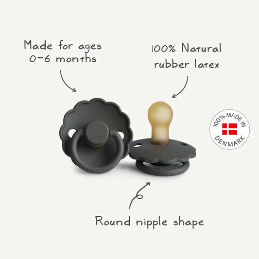 Two black pacifiers with text indicating they are made for ages 0-6 months, made from 100% natural rubber latex, and have a round nipple shape. The brand 'BIBS' is visible.