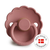Pink pacifier with 'Frigg' branding and 'Made in Denmark' badge on a white background