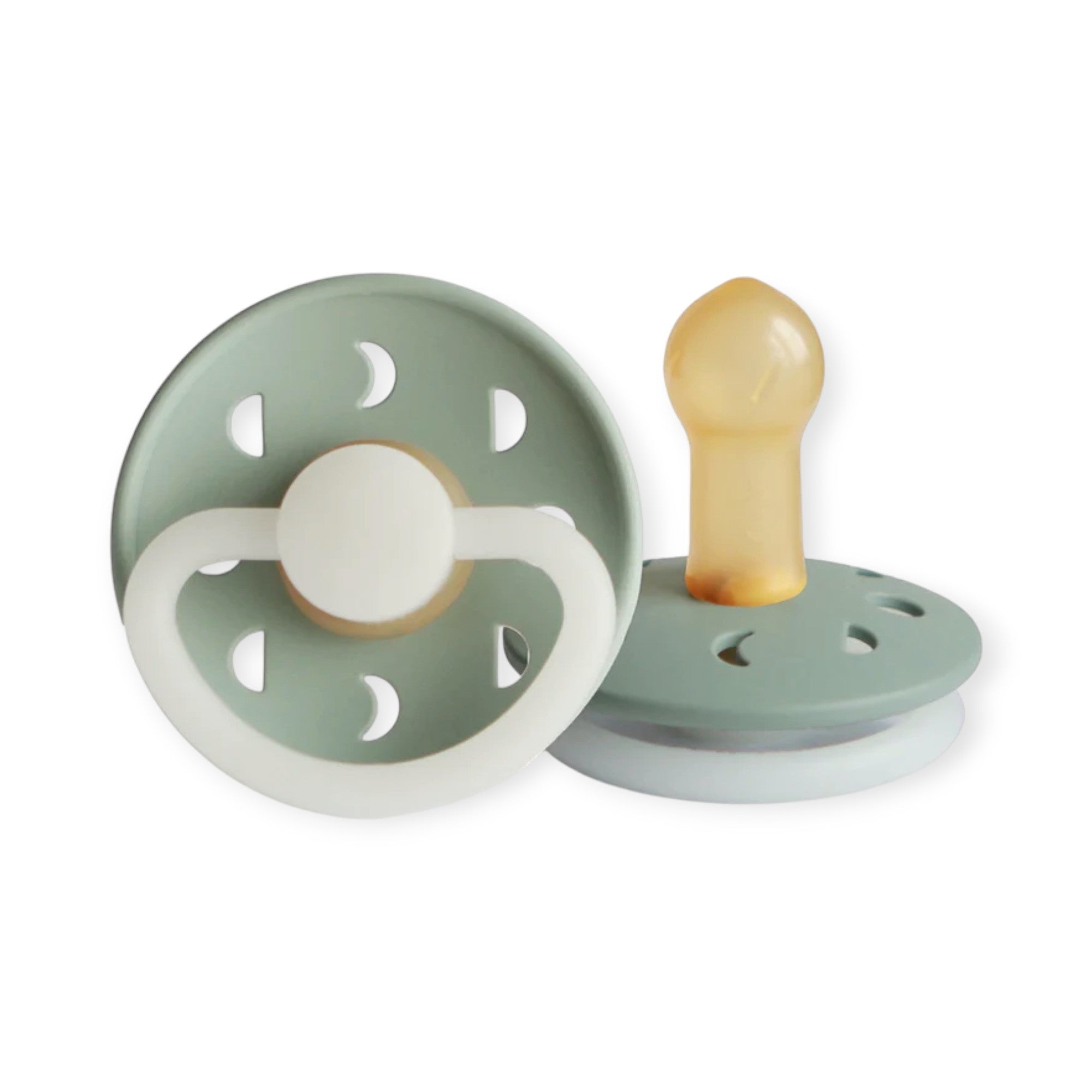 Two green baby pacifiers with wooden and silicone parts on a white background