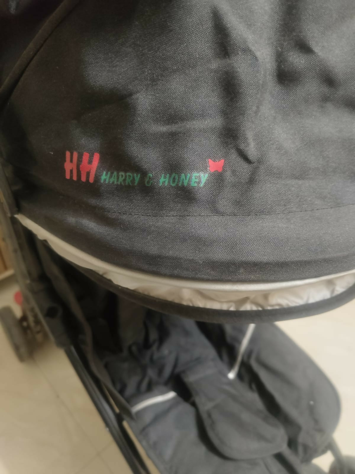 HARRY AND HONEY baby stroller/pram with a lightweight foldable design, reclining seat, adjustable canopy, 5-point safety harness, smooth wheels, and spacious storage basket for comfortable travel with babies and toddlers.