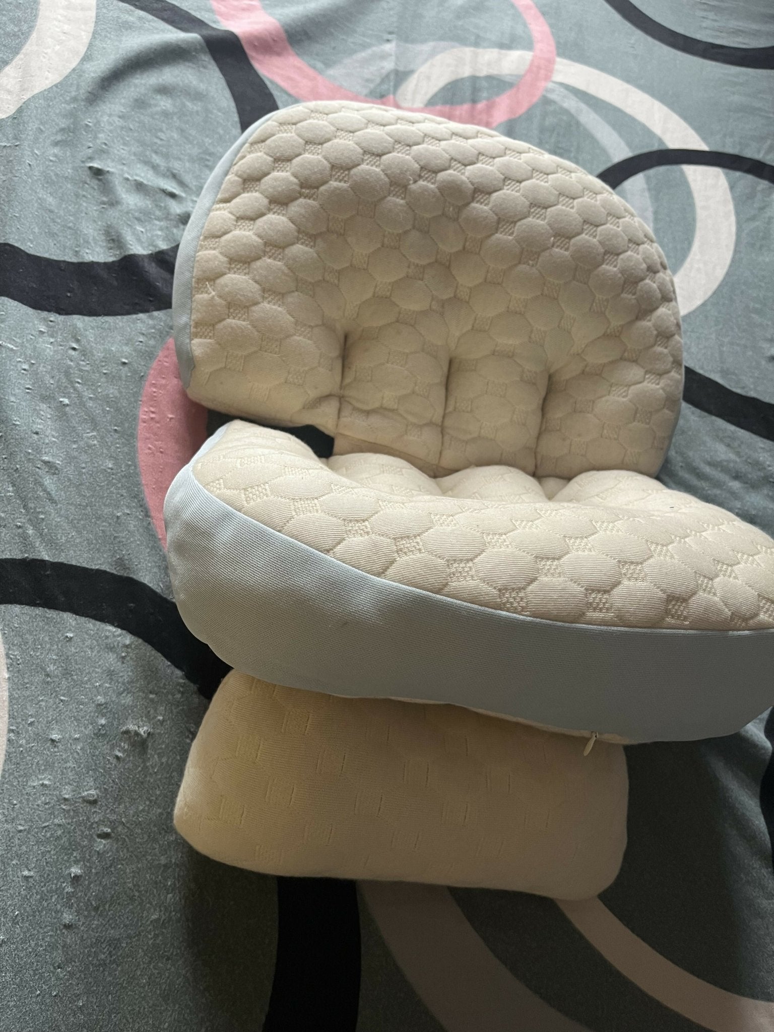 Frido maternity pillow with ergonomic full-body support, soft breathable fabric, and a comfortable design to support the back, belly, hips, and legs during pregnancy.