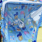 Children's playpen with cartoon animal patterns on a blue background