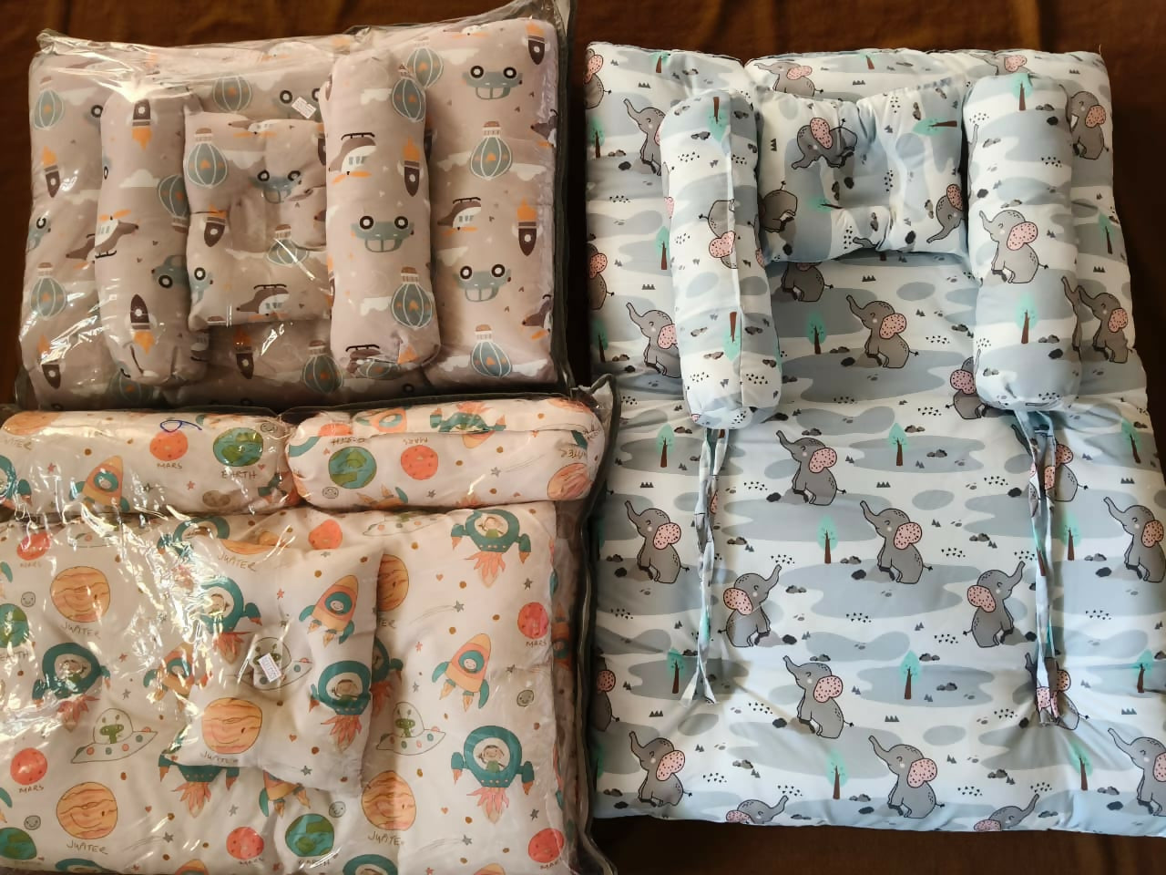 Soft imported baby pillow bedding set with elephant and space-themed prints, cushioned sides, and comfortable support for newborn babies.