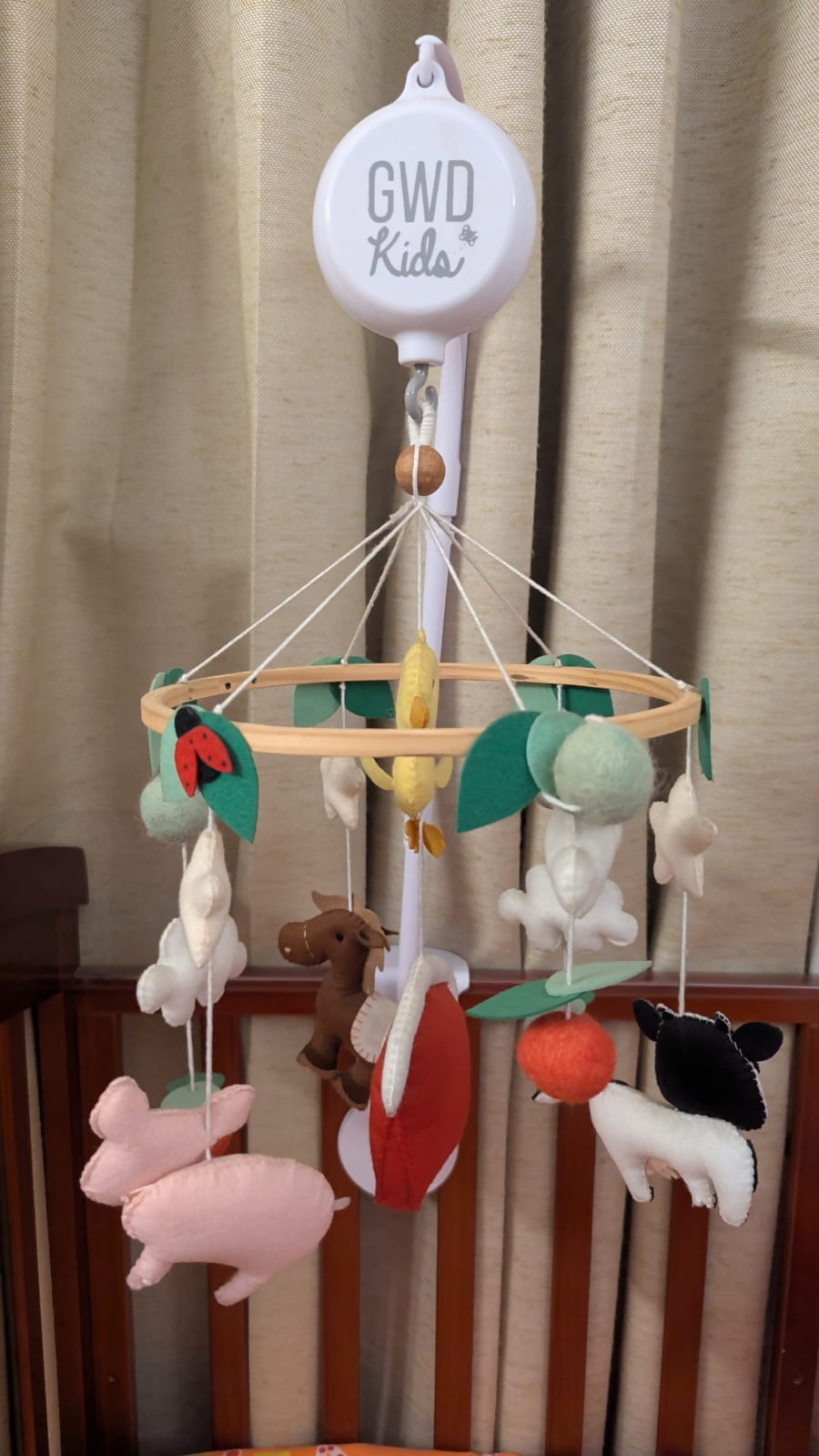GWD KIDS Handmade Farm Animals Cot Mobile with crib arm and battery-operated music box.