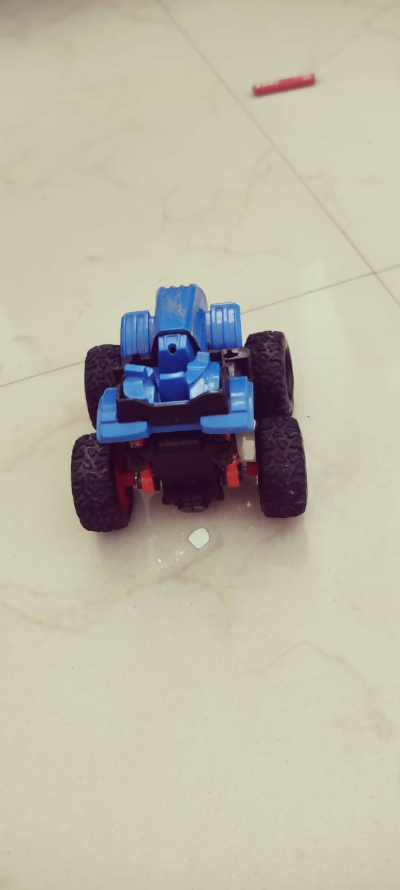 Toy car made of blue and black blocks on a tiled floor