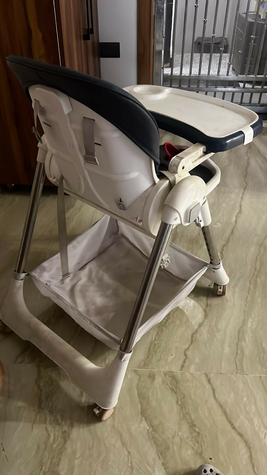 STAR AND DAISY Galaxy Star High Chair with comfortable padded seat, adjustable feeding tray, safety harness, sturdy frame, footrest, and easy-clean design for convenient baby and toddler mealtimes.