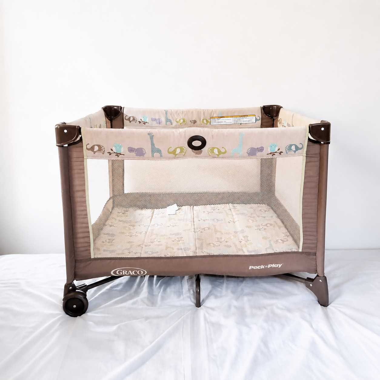 Graco Pack 'N Play Baby Playard Portable Travel Cot B138 in Some Used condition featuring foldable design, breathable mesh sides, animal print, and a spacious enclosed area for supervised play and rest.