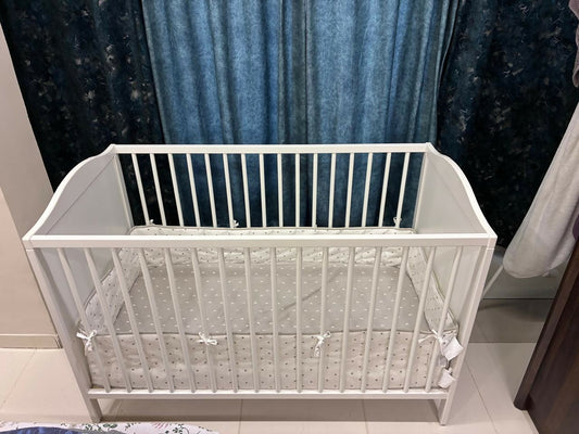 IKEA Baby Cot measuring 60 × 120 cm (23 5/8 × 47 1/4 inches), featuring a simple, practical design with protective side rails and a spacious sleeping area for babies.
