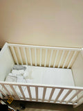 IKEA SUNDVIK Baby Cot in White with mattress and mattress protector, featuring a sturdy wooden frame, adjustable mattress height, classic design, and a safe, comfortable sleeping space for babies.