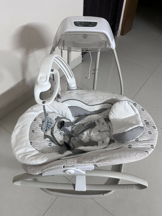 INGENUITY gliding swing and rocker with gentle gliding motion, cushioned seat, safety harness, and soothing design for relaxing, comforting, and entertaining babies.