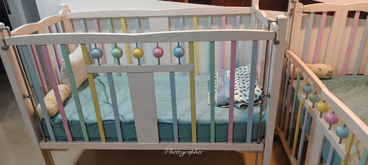 IDEAL HOME Bally Cot/Crib for Baby featuring a sturdy structure, protective side rails and spacious sleeping area, creating a practical and comfortable setup for your baby’s rest and sleep at home.