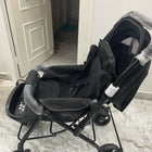 Evenflo travel system with baby stroller and infant car seat, featuring a foldable design, reclining seat, adjustable canopy, 5-point safety harness, and spacious storage basket for convenient travel.