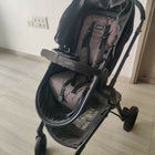 Evenflo travel system with baby stroller and infant car seat, featuring a foldable design, reclining seat, adjustable canopy, 5-point safety harness, and spacious storage basket for convenient travel.