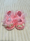 Handcrafted baby booties made from soft, baby-friendly fabric or yarn with a cozy, lightweight design to keep little feet warm, comfortable, and stylish.