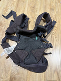 Infantino Flip 4-in-1 Convertible Carrier in Grey with an adjustable ergonomic seat, head support, padded shoulder straps, waist belt, and four carrying positions for babies weighing 3.6–14.5 kg.