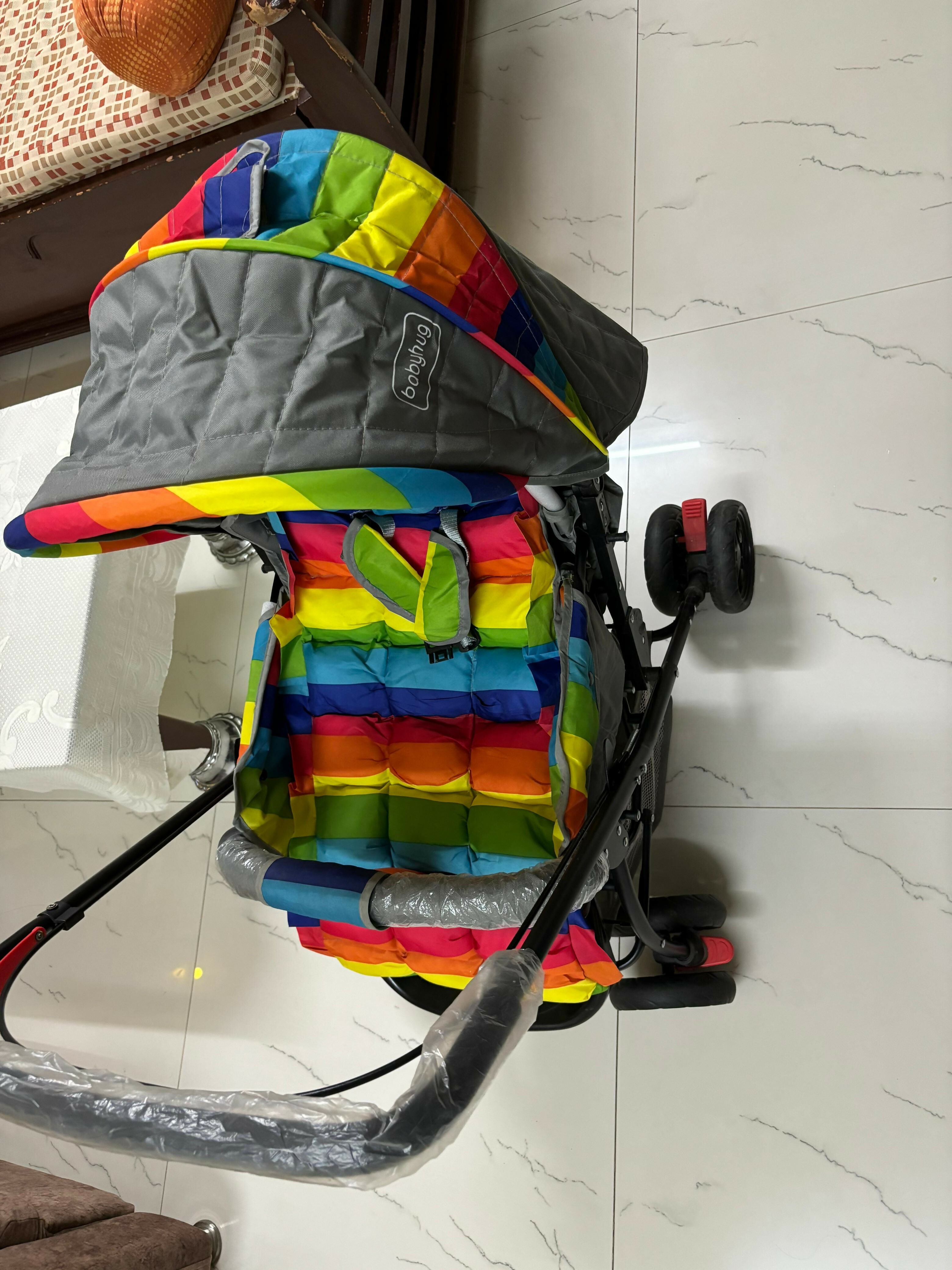 BABYHUG Cosy Cosmo Stroller/Pram with Reversible Handle offers comfort and convenience, featuring a back pocket and smooth maneuverability for your baby’s outings.

