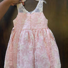Adorn your baby girl in this elegant Pearl and Lace Work Frock, perfect for making precious memories!






