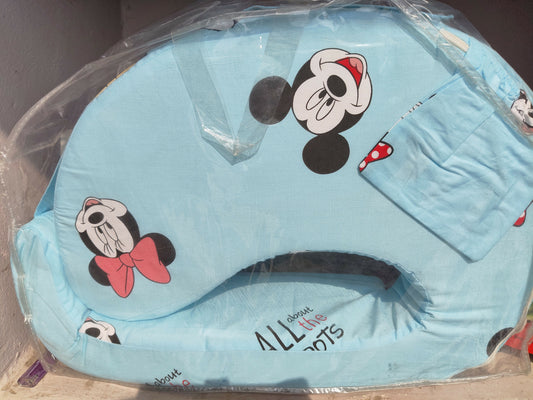 Blue pillow with cartoon character design in clear packaging
