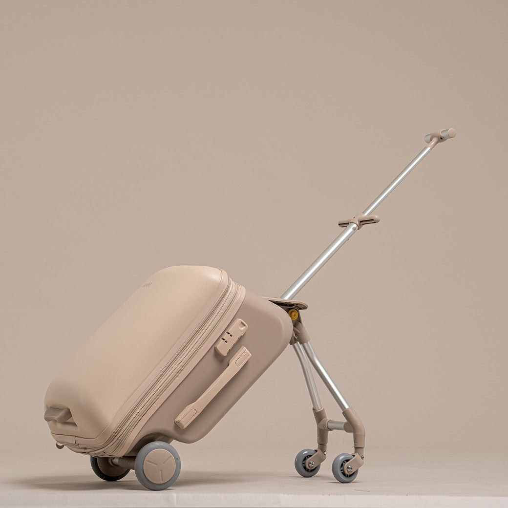 Beige suitcase with a retractable handle on a beige background
