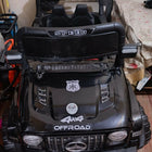 Electric car for kids with a rechargeable battery, realistic steering wheel, comfortable seat, LED lights, durable wheels, and easy controls for fun indoor and outdoor adventures.