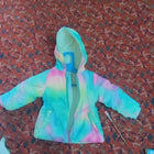 Cozy pastel tie-dye puffer jacket for kids featuring warm padded insulation, a soft lightweight design, front zip closure, and a trendy multicolor pattern for comfortable winter wear.