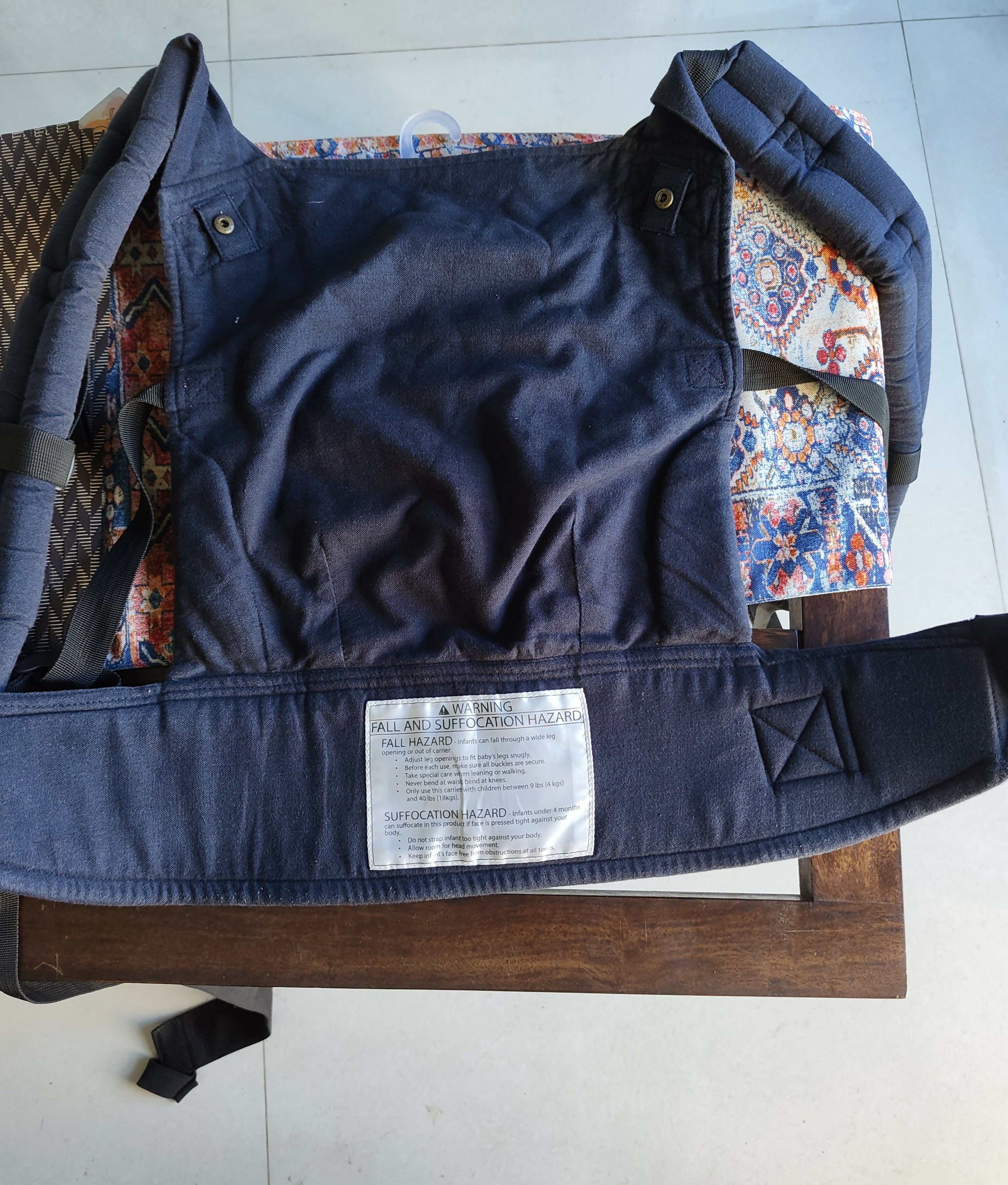 Kol Kol baby carrier with ergonomic support, adjustable straps, cushioned comfort, secure baby carrying design, and hands-free support for babies and toddlers.
