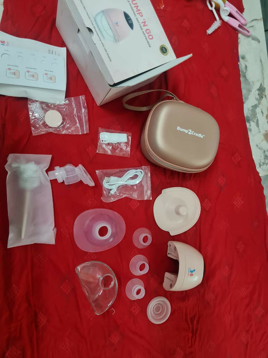Breast pump parts and accessories on a red surface