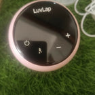 LUVLAP Adore electric breast pump with LUVLAP feeding bottle, adjustable suction settings, compact design, and convenient milk collection support for breastfeeding mothers.
