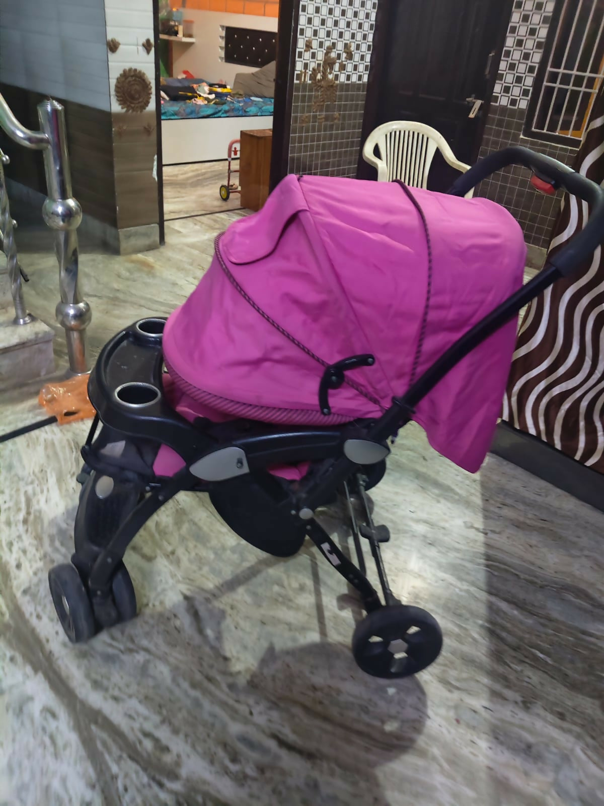 LUVLAP Galaxy stroller in pink with reclining seat, smooth wheels, safety harness, adjustable canopy, and comfortable travel design for babies and toddlers.