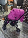LUVLAP Galaxy stroller in pink with reclining seat, smooth wheels, safety harness, adjustable canopy, and comfortable travel design for babies and toddlers.