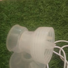 LUVLAP Adore electric breast pump with LUVLAP feeding bottle, adjustable suction settings, compact design, and convenient milk collection support for breastfeeding mothers.