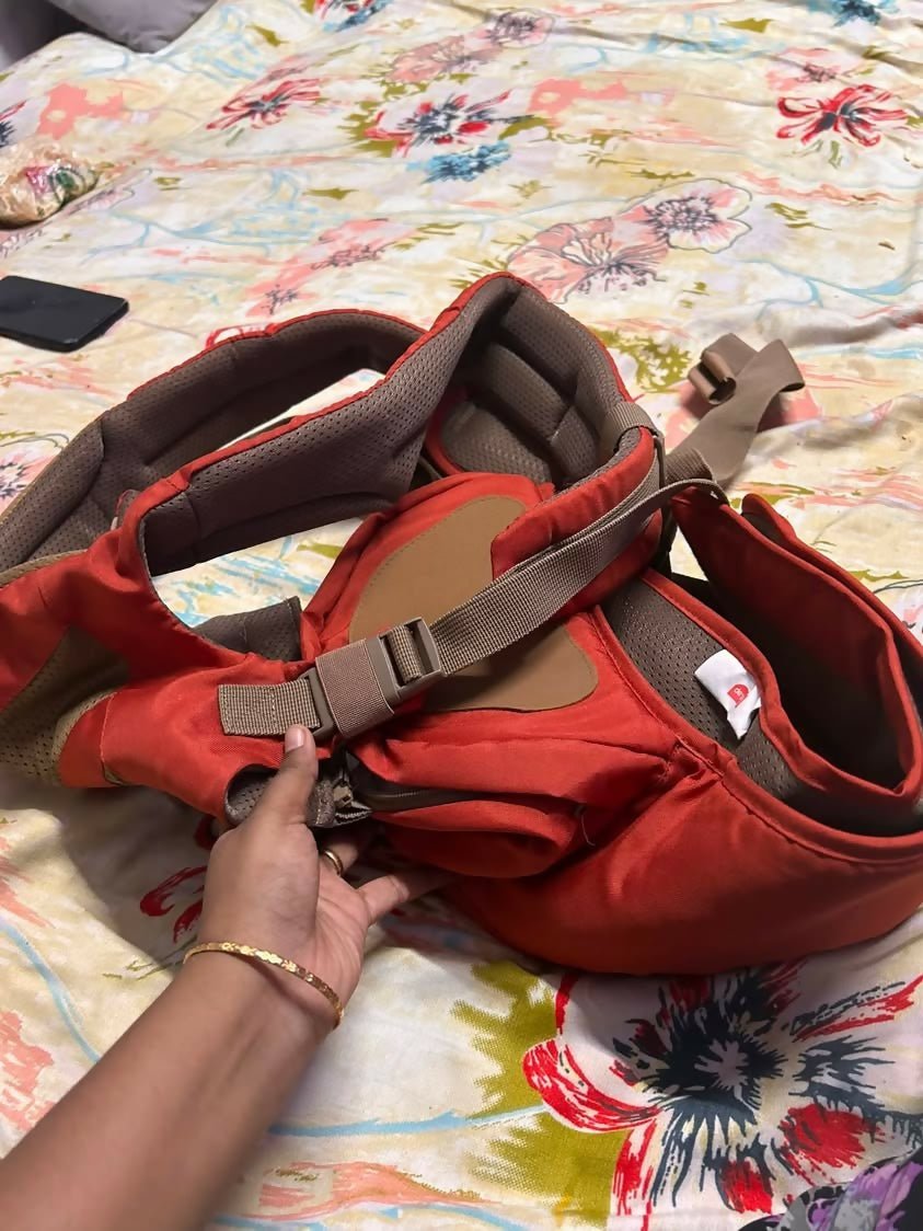 LUVLAP Royal Hip Seat Baby Carrier with an ergonomic hip seat, adjustable shoulder straps, padded waist belt, breathable fabric, and multiple carrying positions for comfortable and secure babywearing.