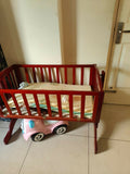 LuvLap wooden cradle with a sturdy wooden frame, gentle rocking motion, protective side rails, and a spacious sleeping area for safe and comfortable rest for newborns and infants.