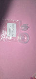 Clear plastic part with packaging labeled 'Extra Part For Pure Use' on a pink background