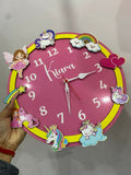 Pink children's clock with decorative elements 