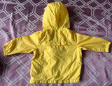 Lion-themed windcheater for kids made from lightweight, wind-resistant fabric with a hood, front zipper, and playful lion design for comfortable outdoor wear.