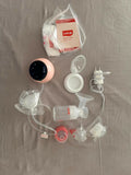 LuvLap Adore electric breast pump with adjustable suction, compact design, milk collection bottle, and comfortable pumping support for breastfeeding mothers.