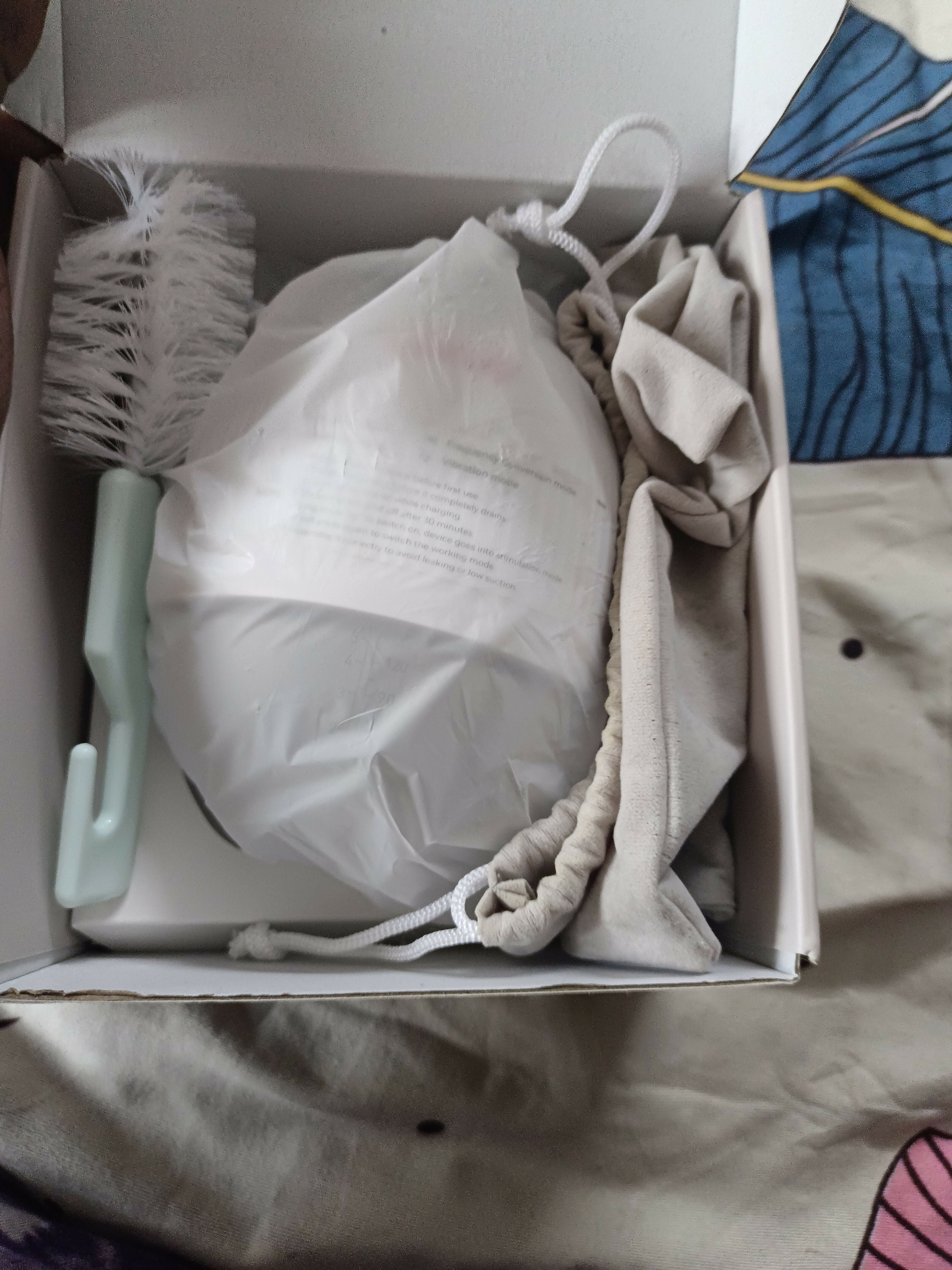 LUVLAP Handsfree/Wearable Breast Pump featuring a compact wearable design, adjustable pumping settings and comfortable fit for convenient hands-free breast milk expression at home, work or while travelling.