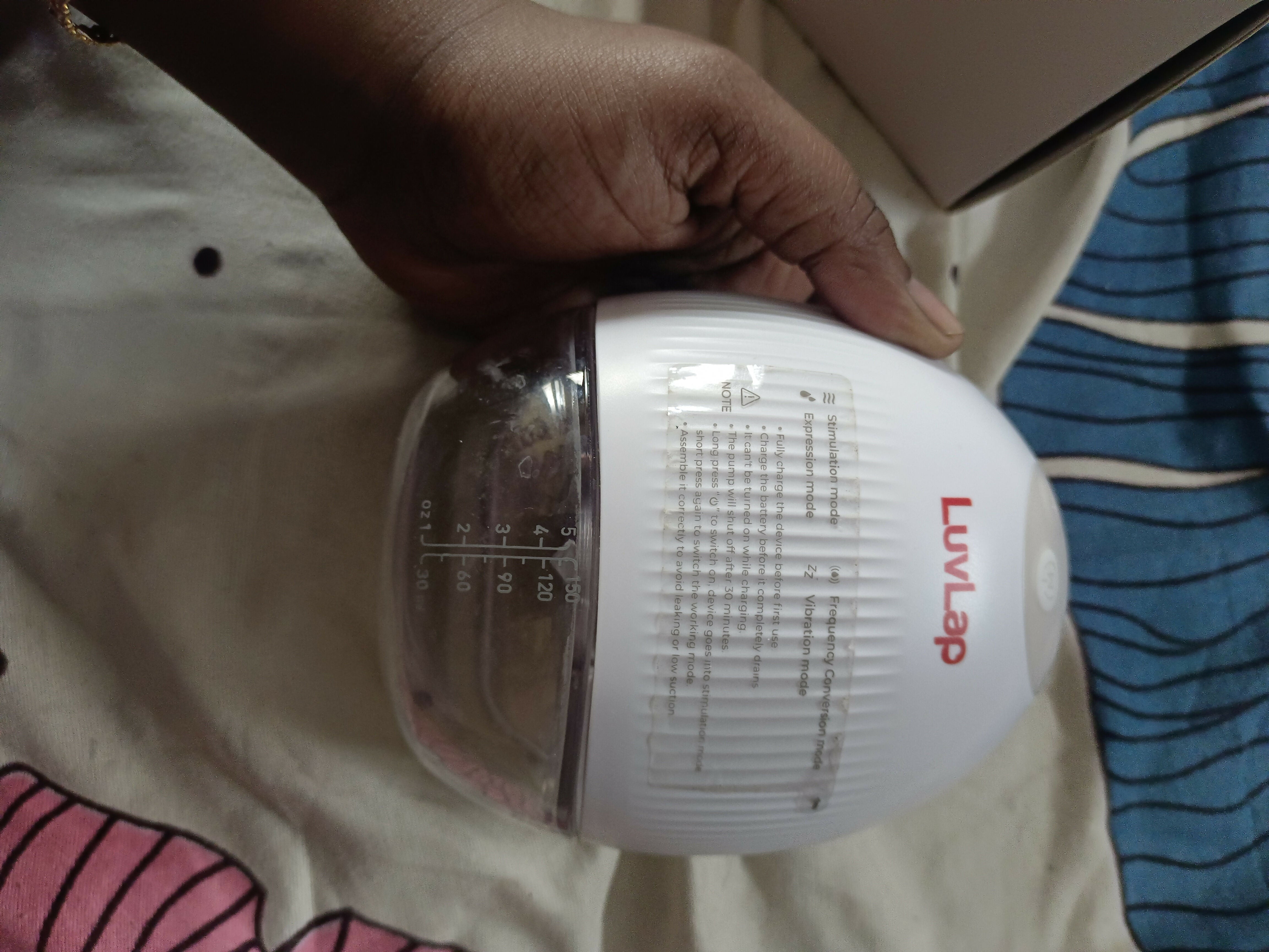 LUVLAP Handsfree/Wearable Breast Pump featuring a compact wearable design, adjustable pumping settings and comfortable fit for convenient hands-free breast milk expression at home, work or while travelling.