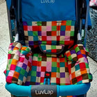 A blue LuvLap stroller with a colorful patchwork-patterned seat cushion 