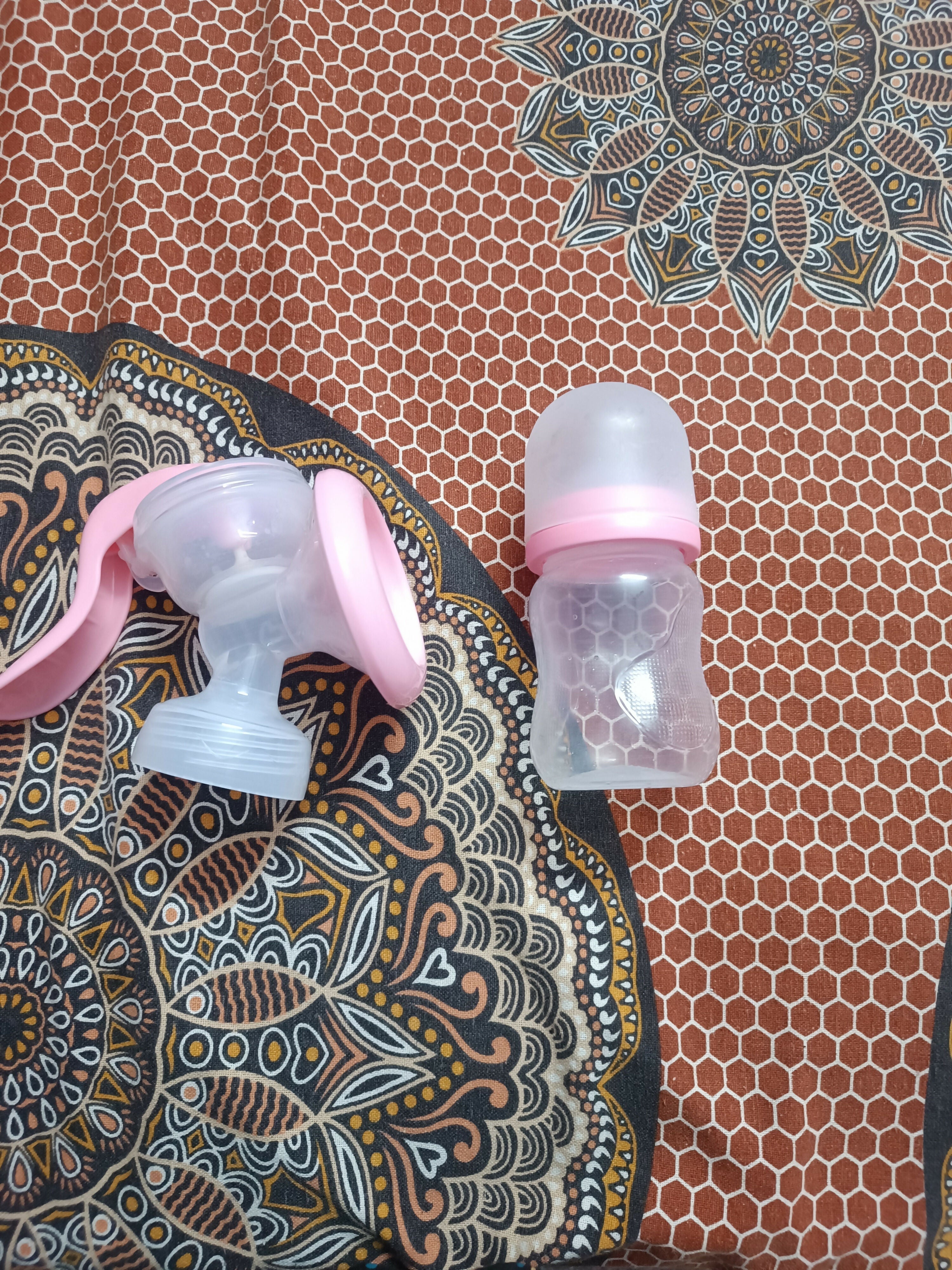 LuvLap Manual Breast Pump featuring a simple hand-operated design and comfortable breast cushion, offering a compact and convenient option for occasional pumping at home or while travelling