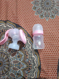 LuvLap Manual Breast Pump featuring a simple hand-operated design and comfortable breast cushion, offering a compact and convenient option for occasional pumping at home or while travelling