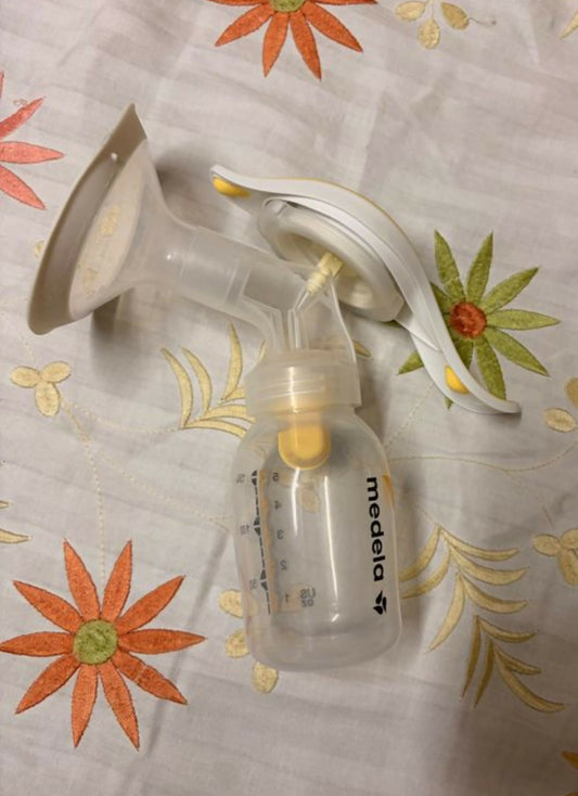 MEDELA Harmony Flex Manual Breast Pump in Almost New condition featuring a compact hand-operated design, comfortable breast shield and easy manual pumping mechanism for convenient breast milk expression at home or while travelling.