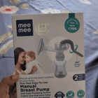 MEE MEE Manual Breast Pump with ergonomic hand pump, soft silicone massage cushion, BPA-free components, lightweight portable design, and comfortable manual milk expression for breastfeeding mothers.
