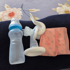 MEE MEE Manual Breast Pump with ergonomic hand pump, soft silicone massage cushion, BPA-free components, lightweight portable design, and comfortable manual milk expression for breastfeeding mothers.