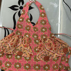 Floral apron with matching pouch on a white background