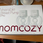 Momcozy S12 Pro Wearable Breast Pump with hands-free wearable design, adjustable suction levels, rechargeable battery, quiet operation, leak-resistant collection cups, and BPA-free components for comfortable milk expression.
