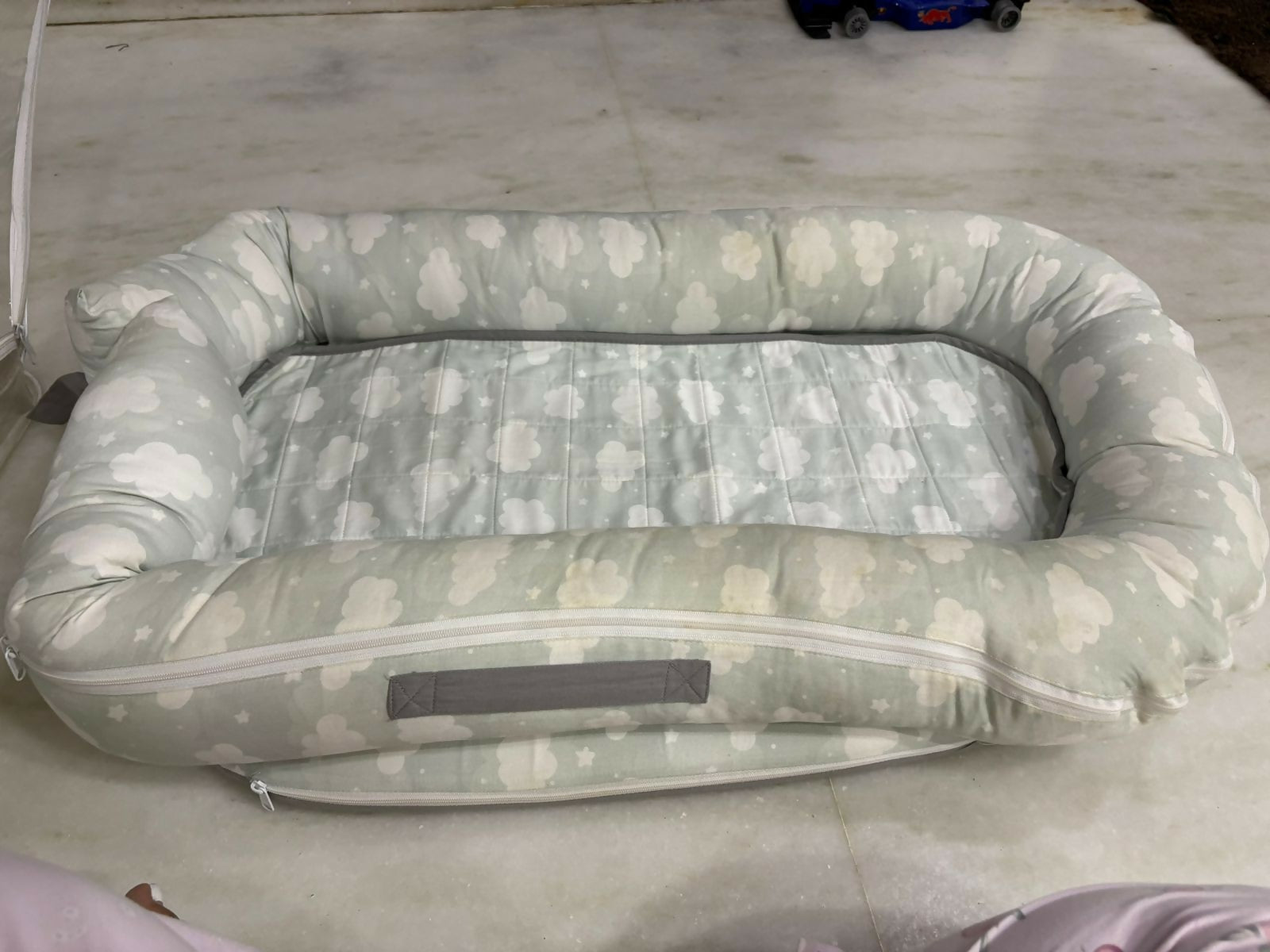 Mothercare Baby Cocoon with soft cushioned fabric, snug wrap design, and cozy support to keep newborns comfortable during sleep, rest, and travel.